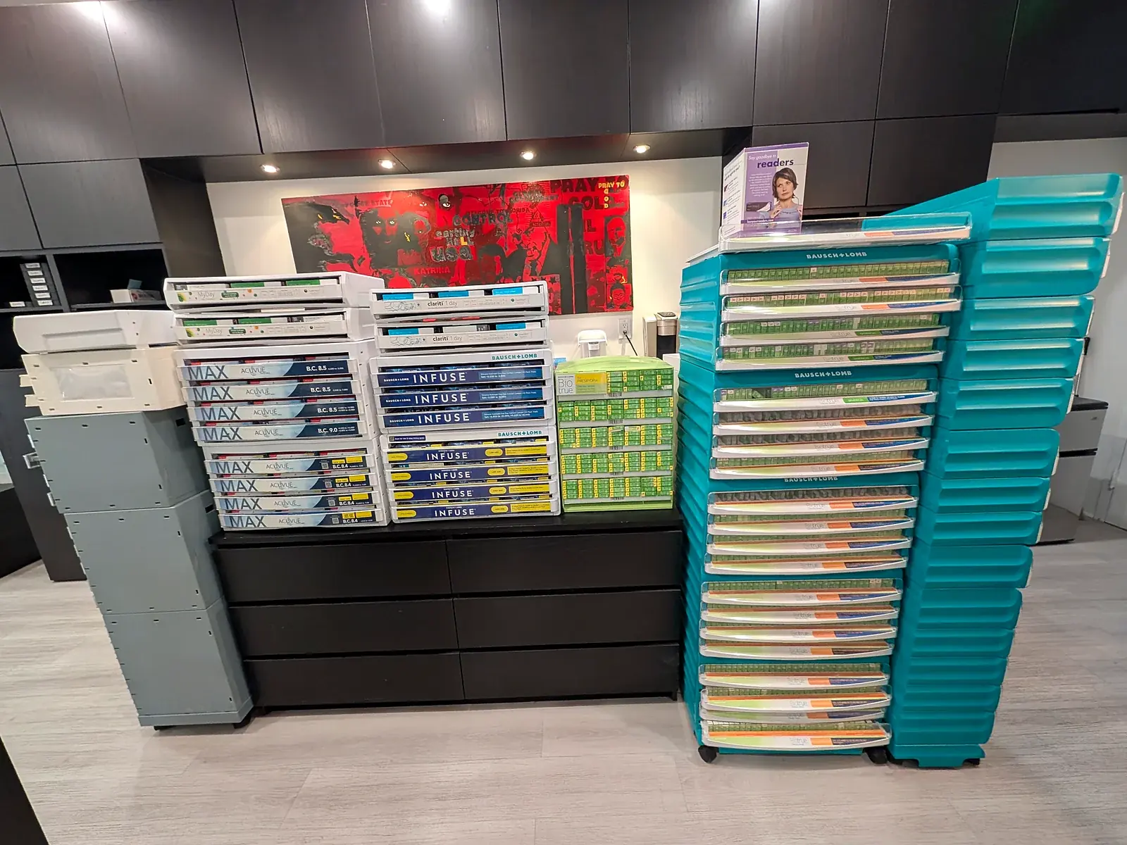 Contact lens stock arranged in cabinets and turquoise storage trays at Park Slope Eye