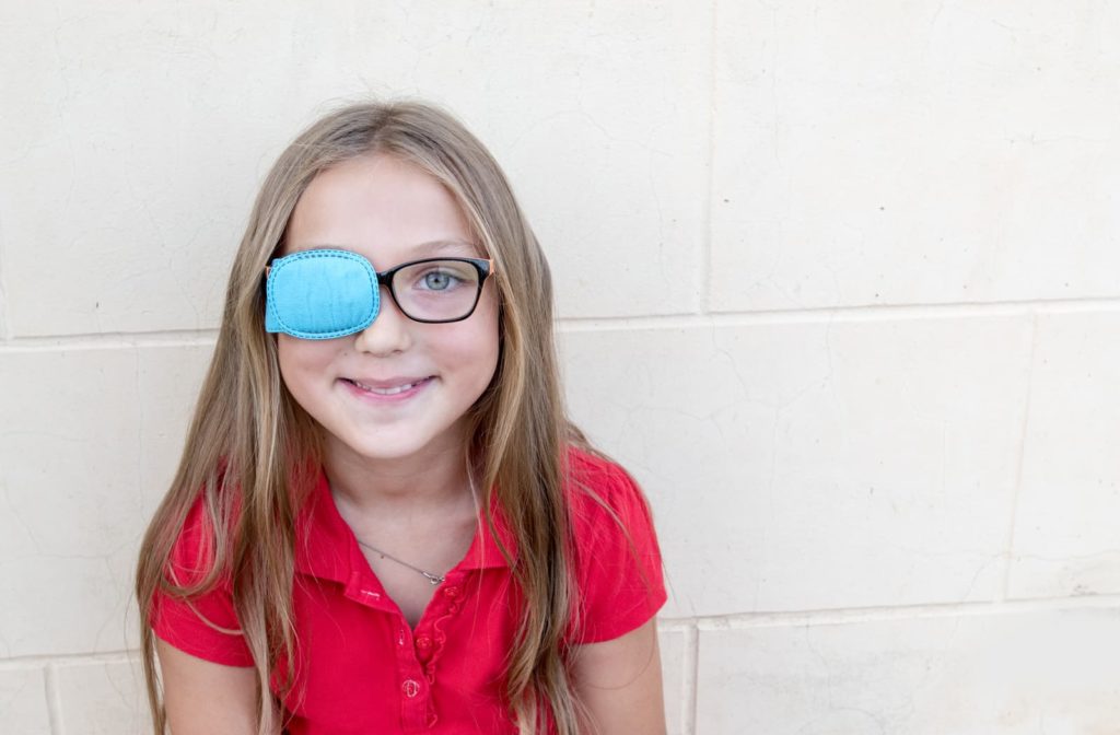 child with one eye covered to help treat her lazy eye