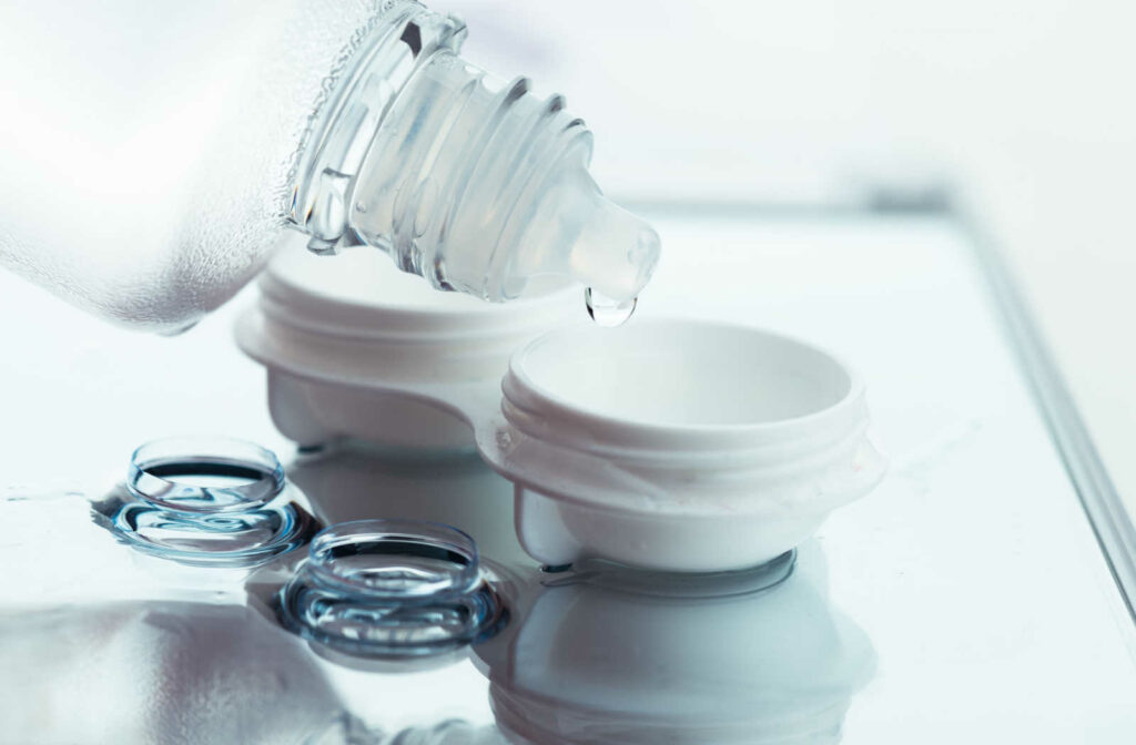 Contact lens solution being poured into a contact lens case to help clean the contact lenses to ensure no eye irritation or burning
