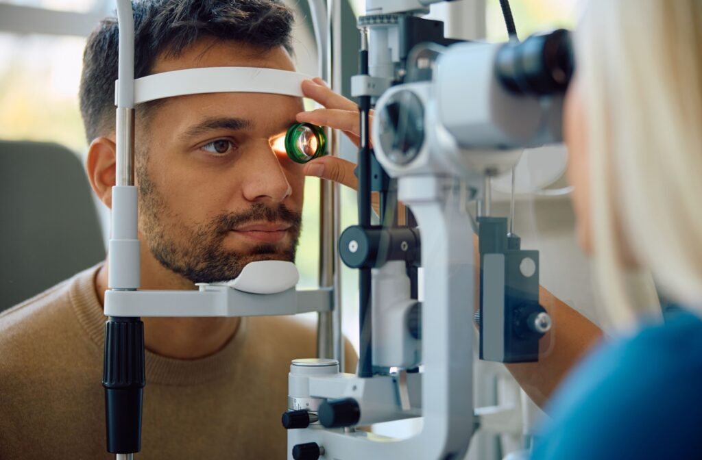 A young man undergoes an ocular health assessment during their emergency eye care visit.